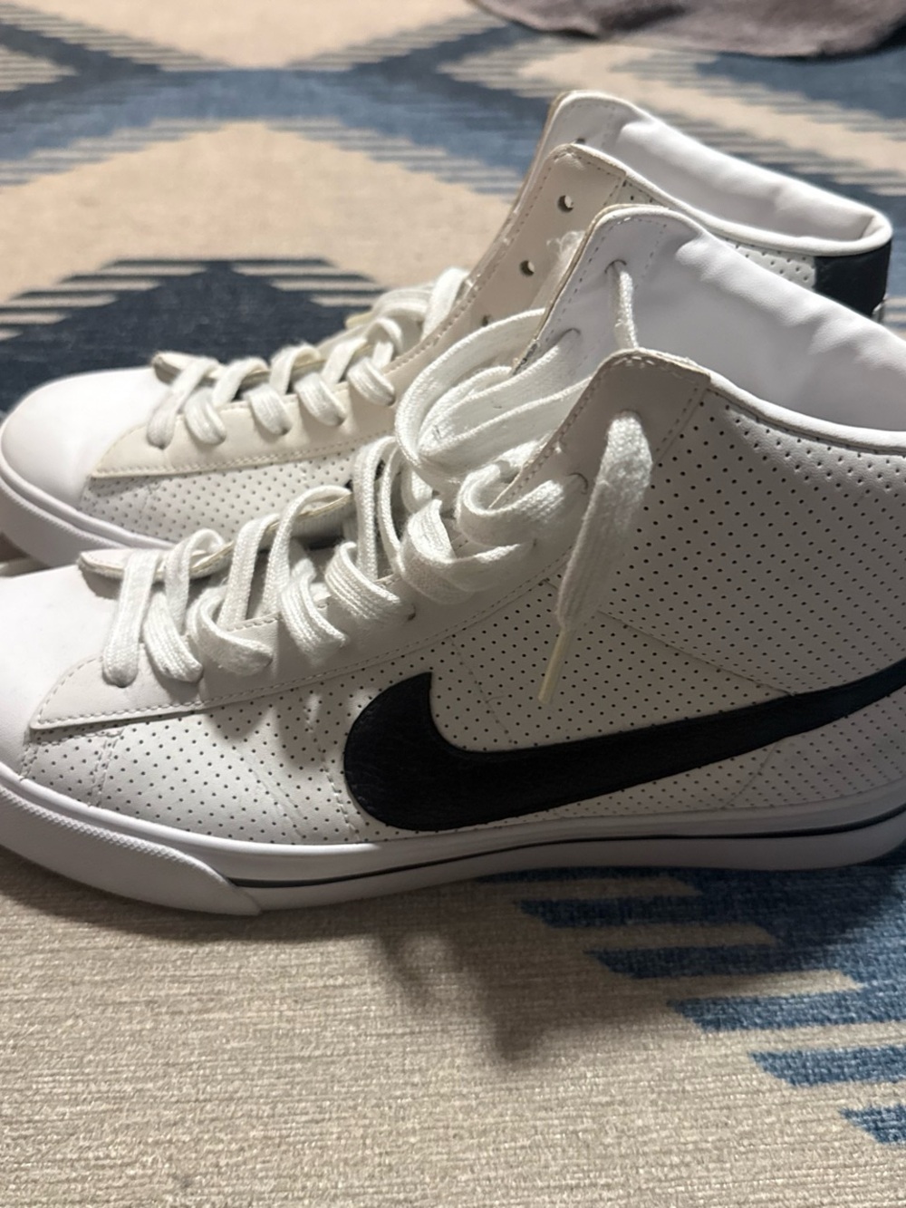 Nike White High-Top Sneakers with Black Swoosh